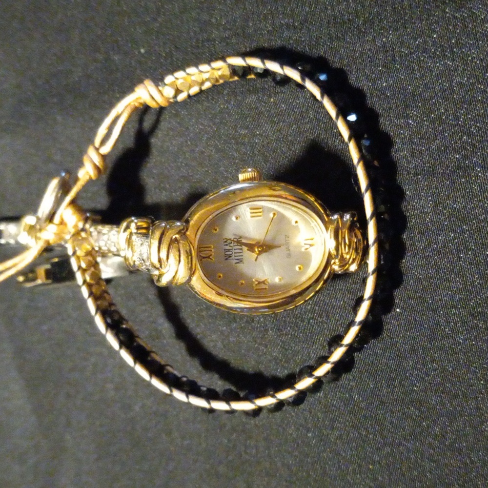 Nolan Miller Gold and Silver Watch with flashy crystals on the band